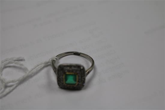 A white metal, emerald and diamond tablet cluster ring, size K.